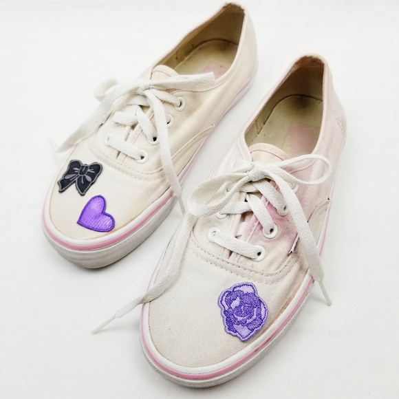 pink and white low top vans